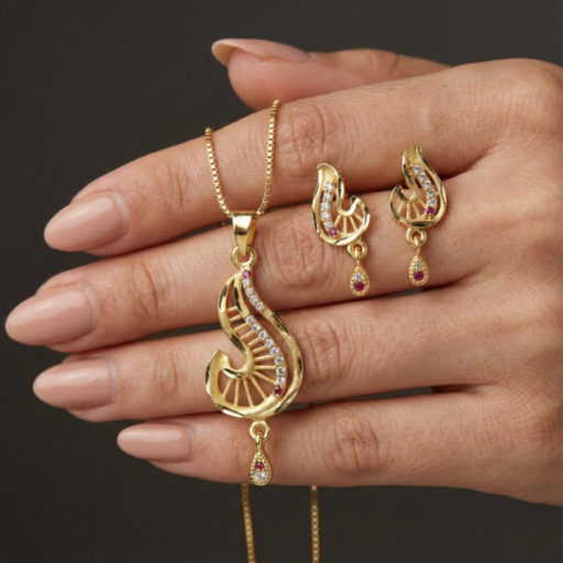 Elegant Gold-Tone Pendant & Earrings Combo Set | Curved Leaf Motif with Crystal & Red Stone Accent | Designer Jewelry Set for Women