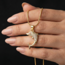 Gold Tone Crystal Dolphin Pendant Necklace – Pave CZ Body with Red Eye Accent on Snake Chain – Playful Ocean Animal Jewelry for Women